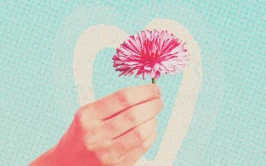 Hand holding a flower with halftone image effect.